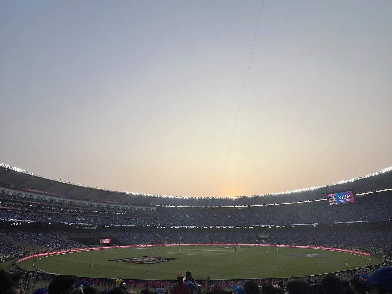Narendra Modi Stadium in Ahmedabad at dusk, stands full